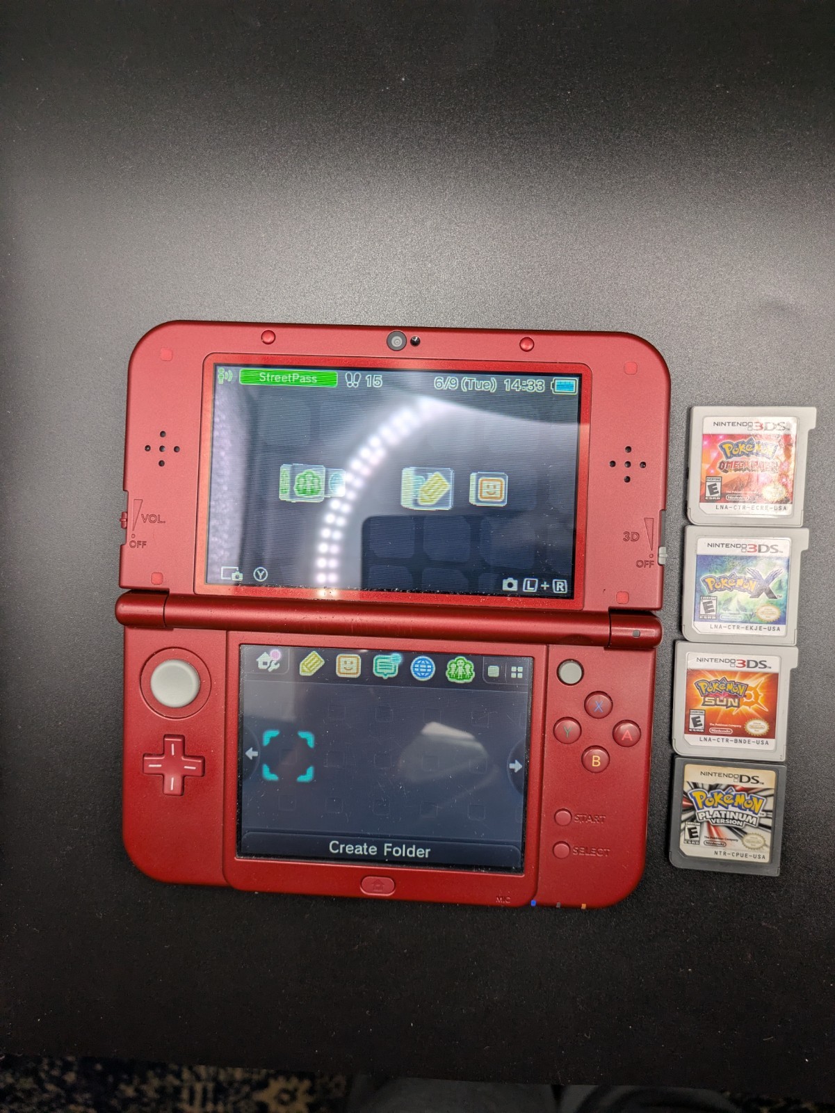 Nintendo New 3DS XL Red Console Bundle w/ Pokemon Platinum, Sun, X, Omega Ruby