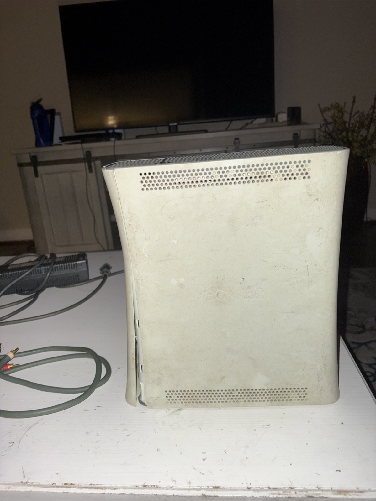 Xbox 360 With Cables Included. No Controller included Also, Not Sure If It Works