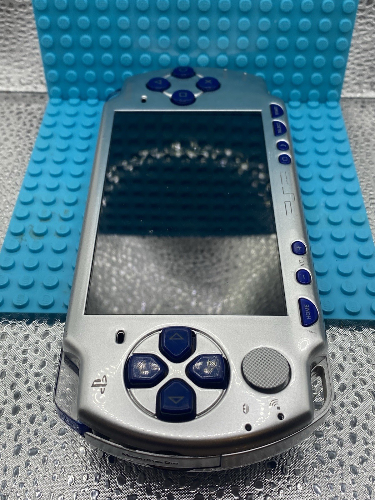 PlayStation PSP-2006 Silver No Battery Turns On Does Not Read Disk For Parts