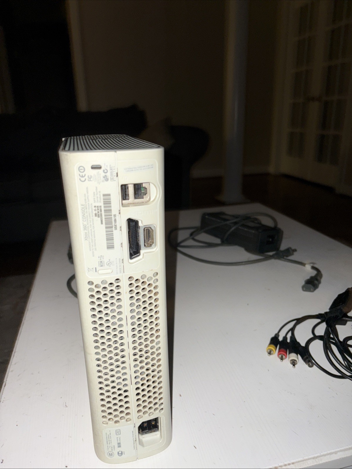 Xbox 360 With Cables Included. No Controller included Also, Not Sure If It Works
