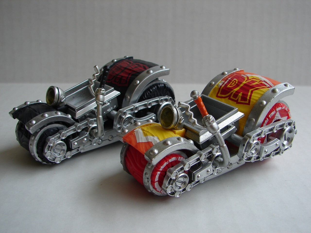 two different Skylanders: SuperChargers: Dark Barrel Blaster and yellow