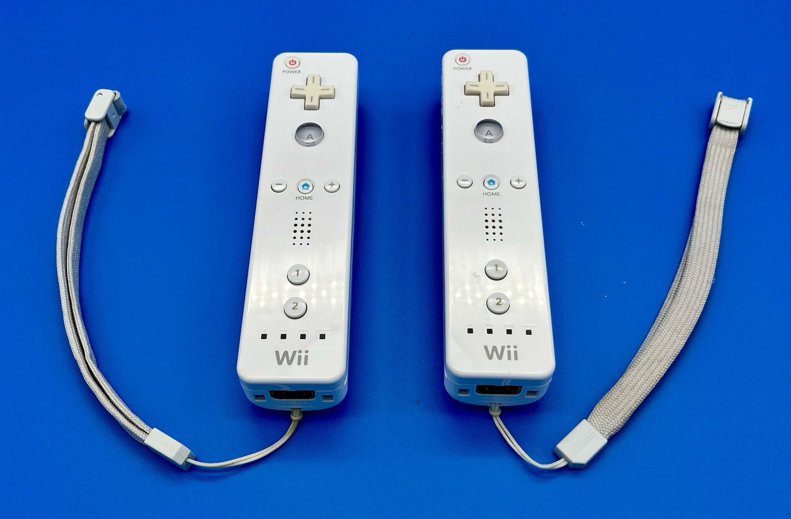 “Not Working”- Nintendo Wii White Remotes (2) with Straps & Sports Attachments