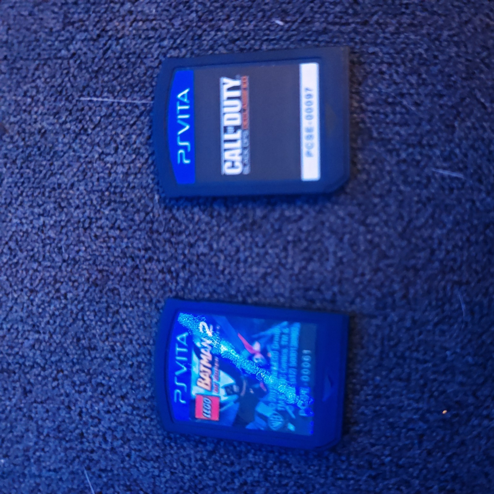 Sony PS Vita with games, Carrying Case, charge cable, and Thumb Grips.