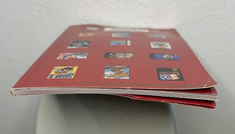 Super Mario History 1985-2010 25th Anniversary Booklet Pre Owned FAST SHIPPING