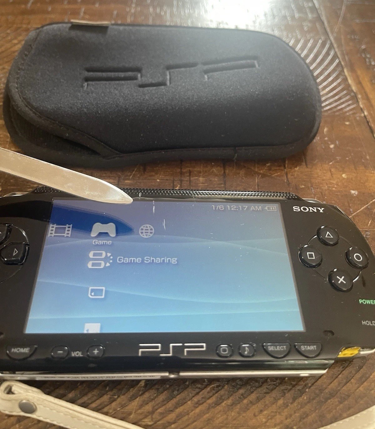 Sony PSP-1001 Console, 2 Batteries w/Charger, 4 Games, 2 Movies, Family Guy 1&2