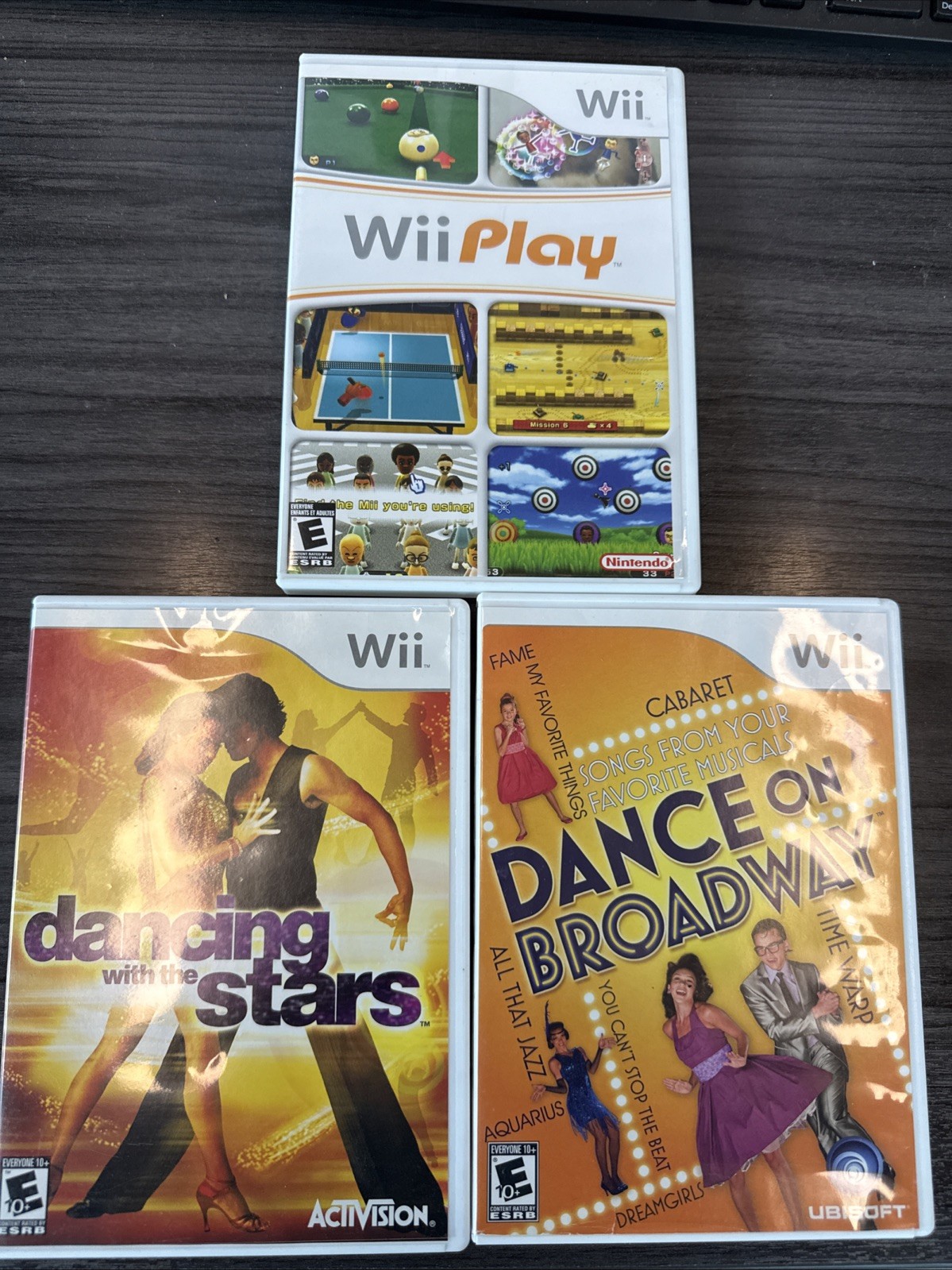 3 Popular Wii games In their Cases With Pamphlets.