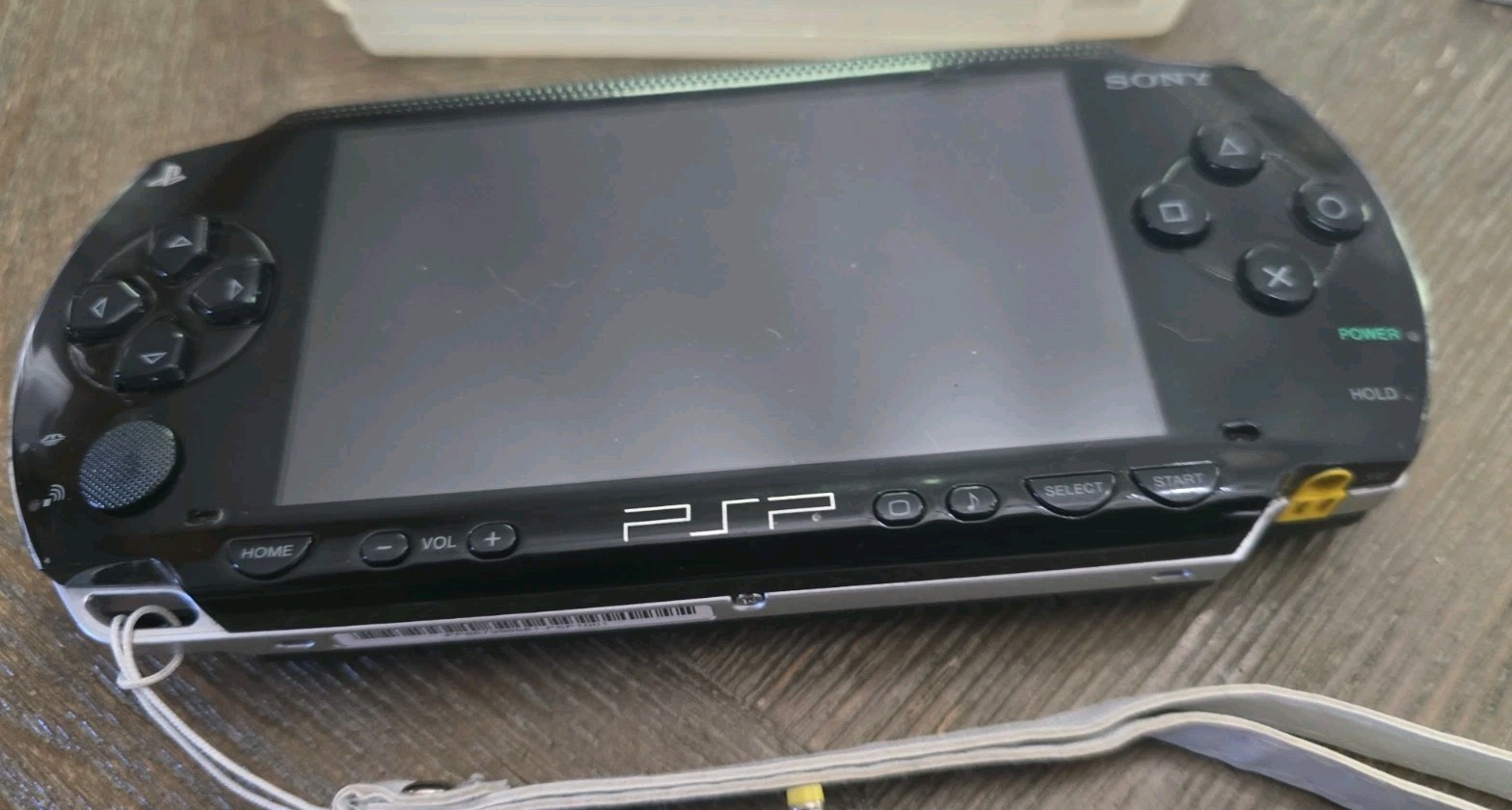 Sony PSP-1001 Black Handheld System, Charger, Memory Cards, And Cases. Read !!