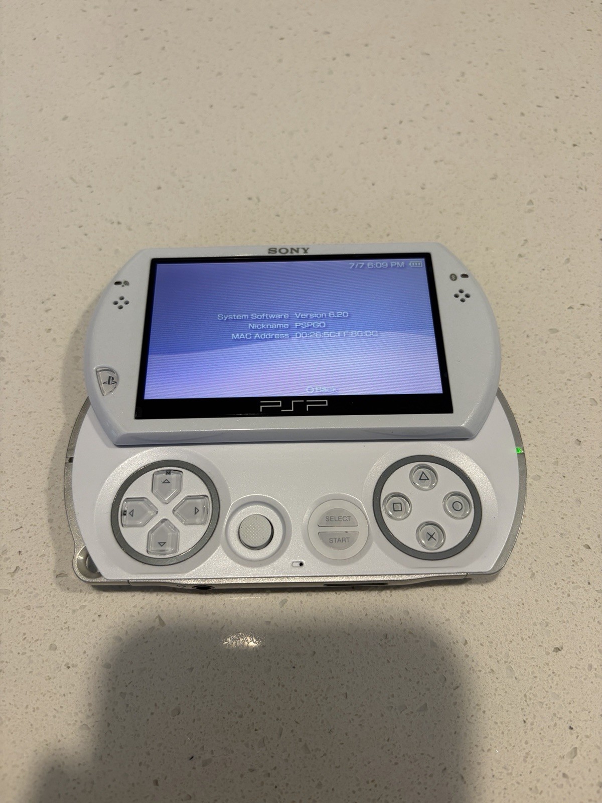 Sony PSP Go White/Silver 16GB Wi-Fi Region Free Handheld w/ AC Adapter