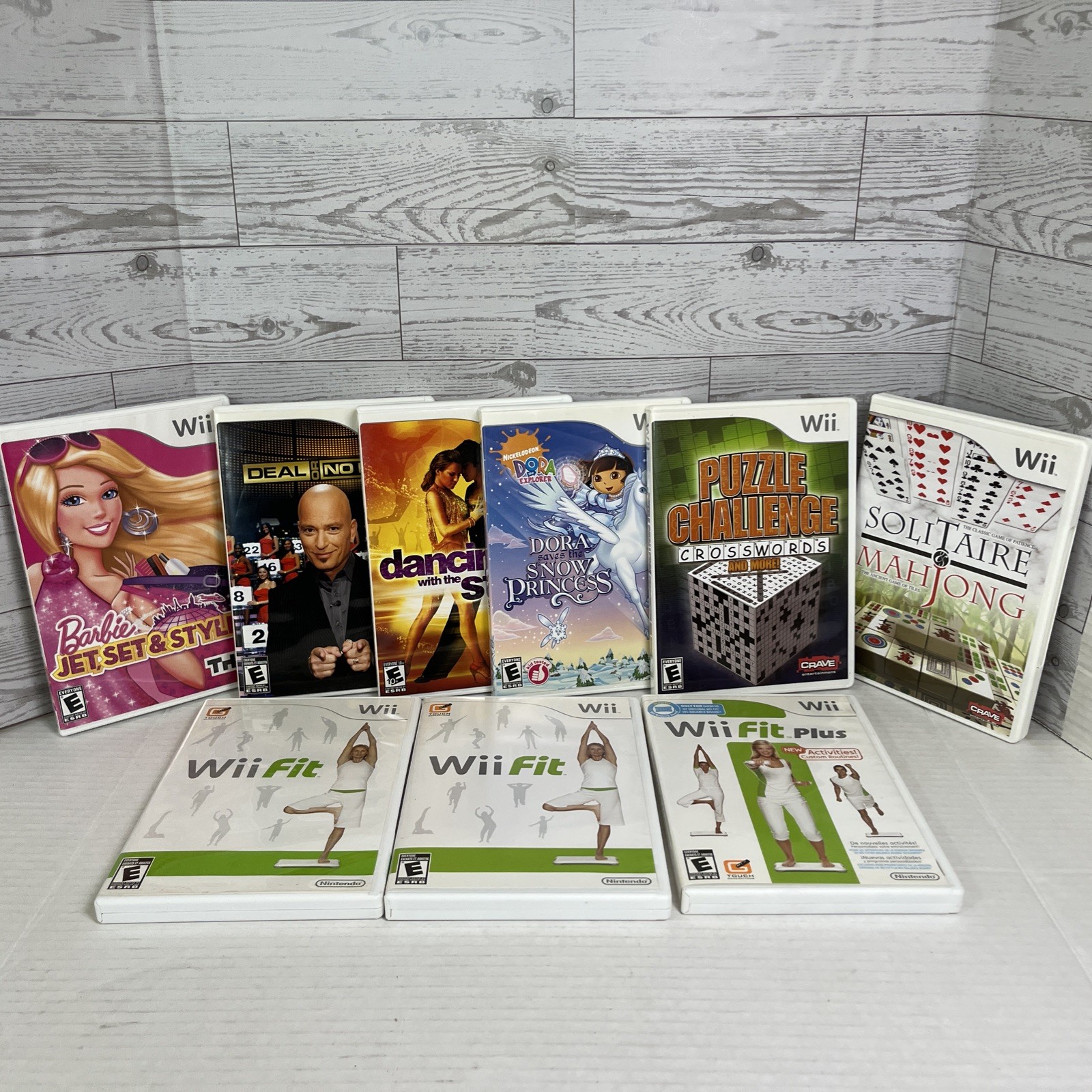 Lot of 8 Nintendo Wii Games Barbie Dora Wii Fit Plus Puzzle Deal or No Deal.