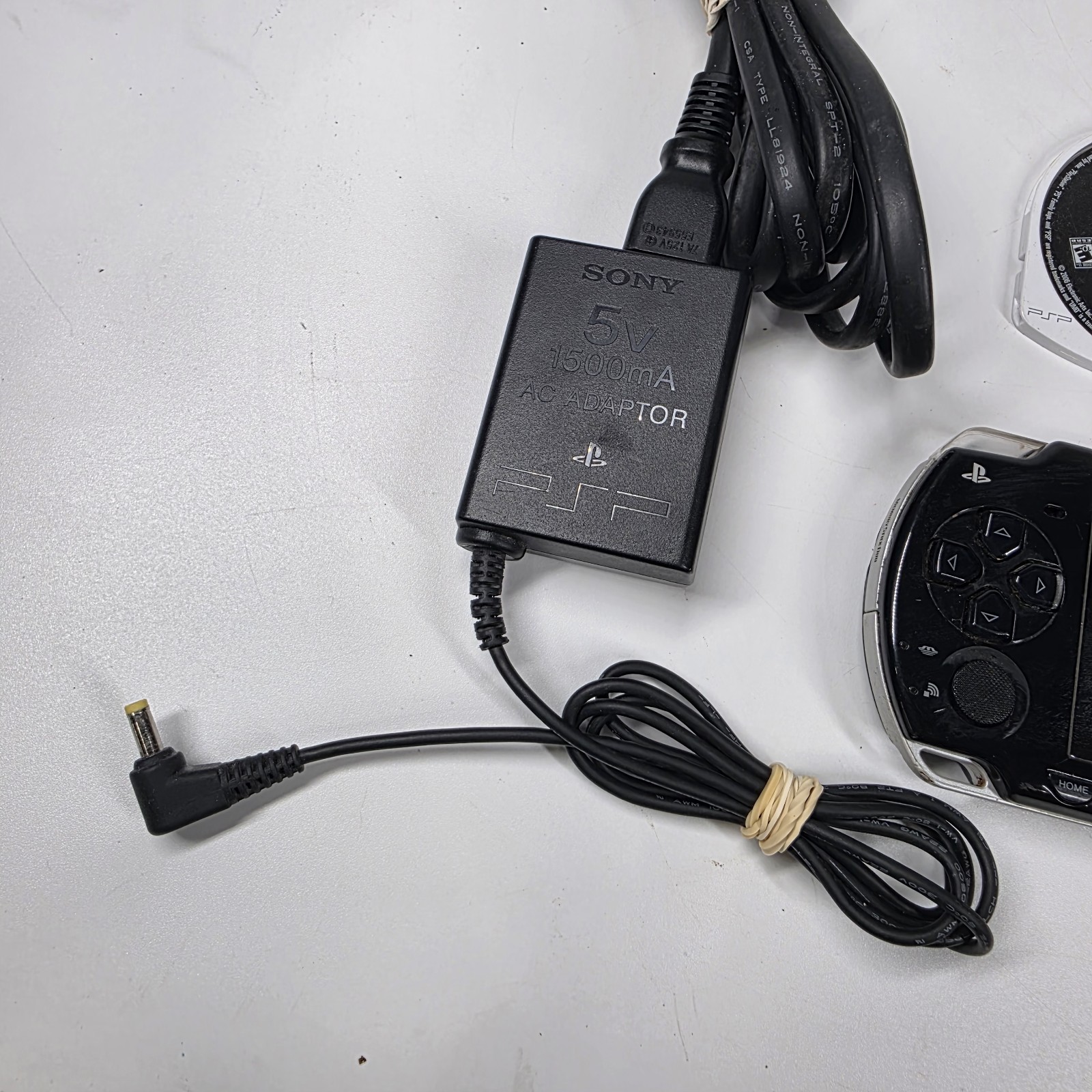 Sony PSP-2001 Slim Edition Black w/ Charger & Need For Speed Carbon – No Battery
