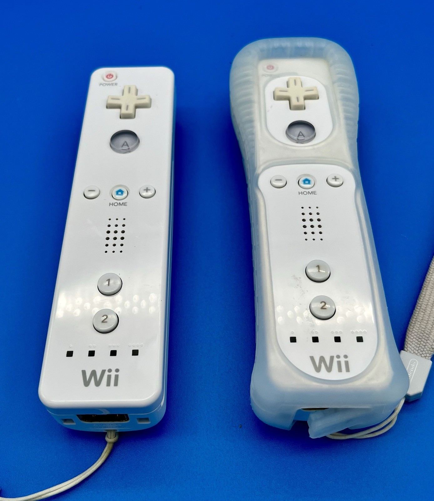 “Not Working”- Nintendo Wii White Remotes (2) with Straps & Sports Attachments