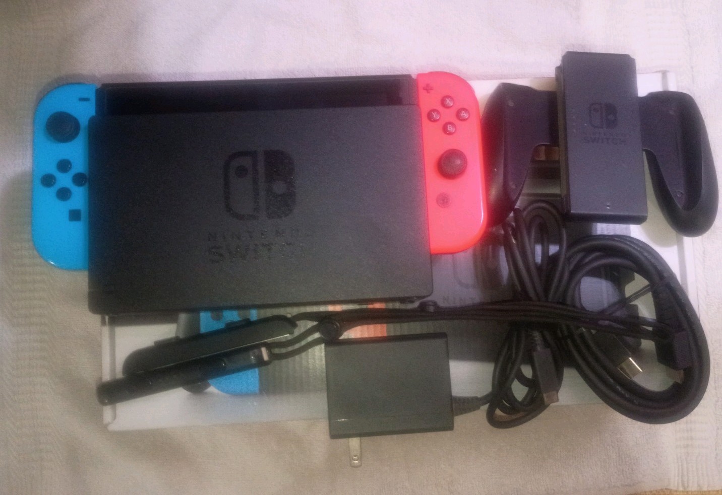 Nintendo Switch with Neon Blue and Neon Red Joy-Con