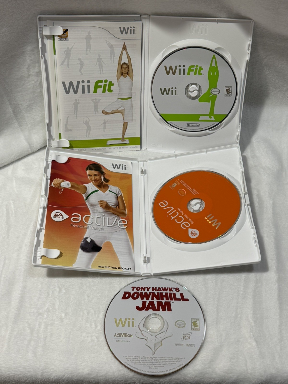 Nintendo Wii console with 2 remotes, 1 silicone sleeve & Nerf sports attachments