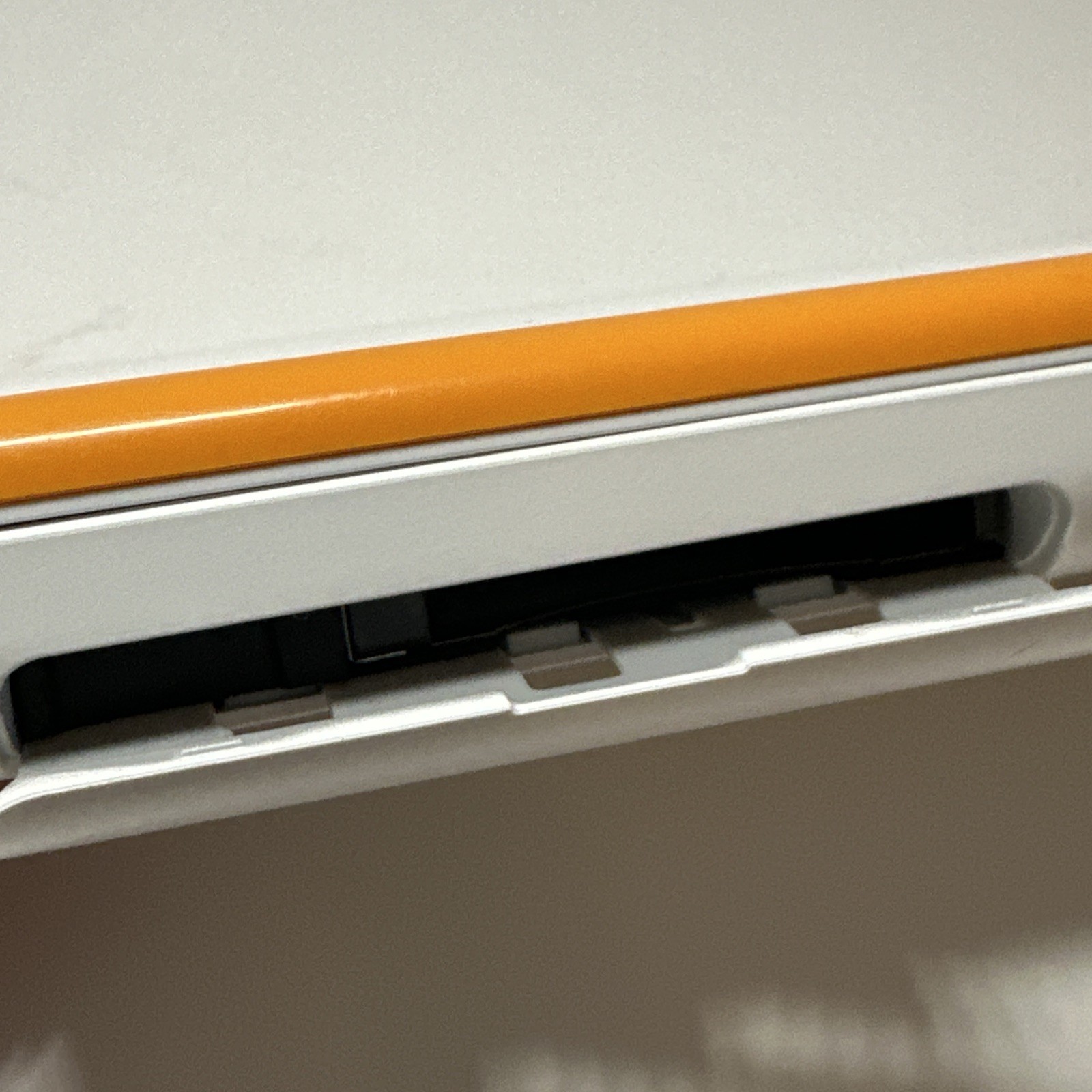 Nintendo 2DS XL – Orange & White Bundle (Top Screen Crack/ Non-OEM Charger)