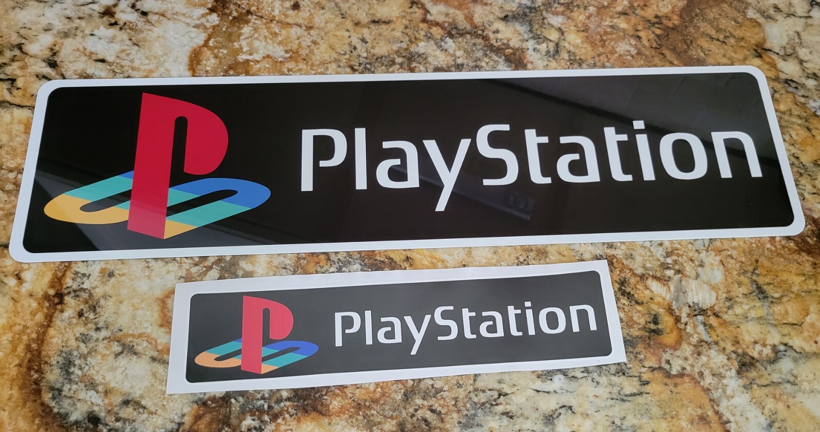 Playstation Logo Aluminum black background 6″ x 23″ with free decal.