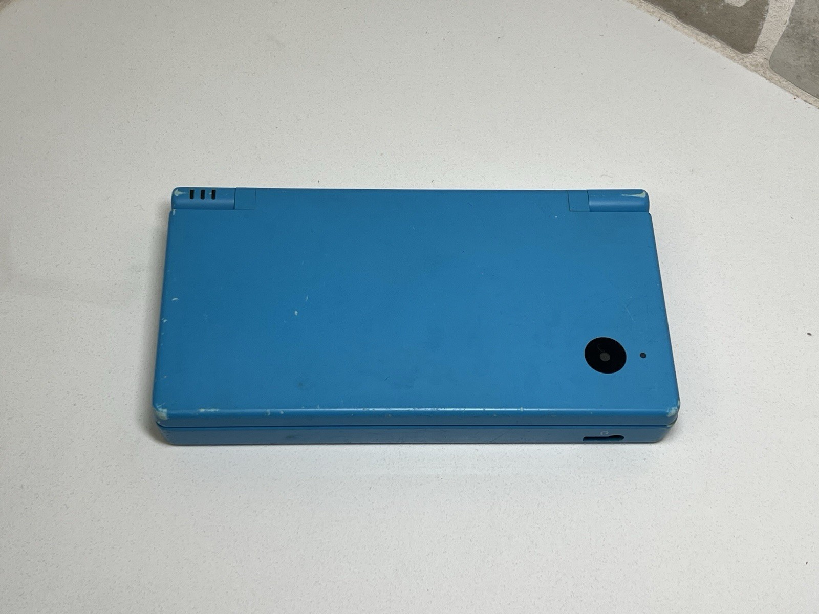 Nintendo DSi Light Blue Handheld Console Game System + Charger + Stylus Tested
