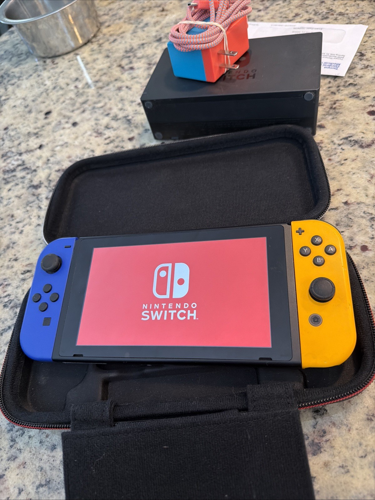 Nintendo Switch Gray Console with Orange and Neon Blue Joy-Con Charger Dock Case