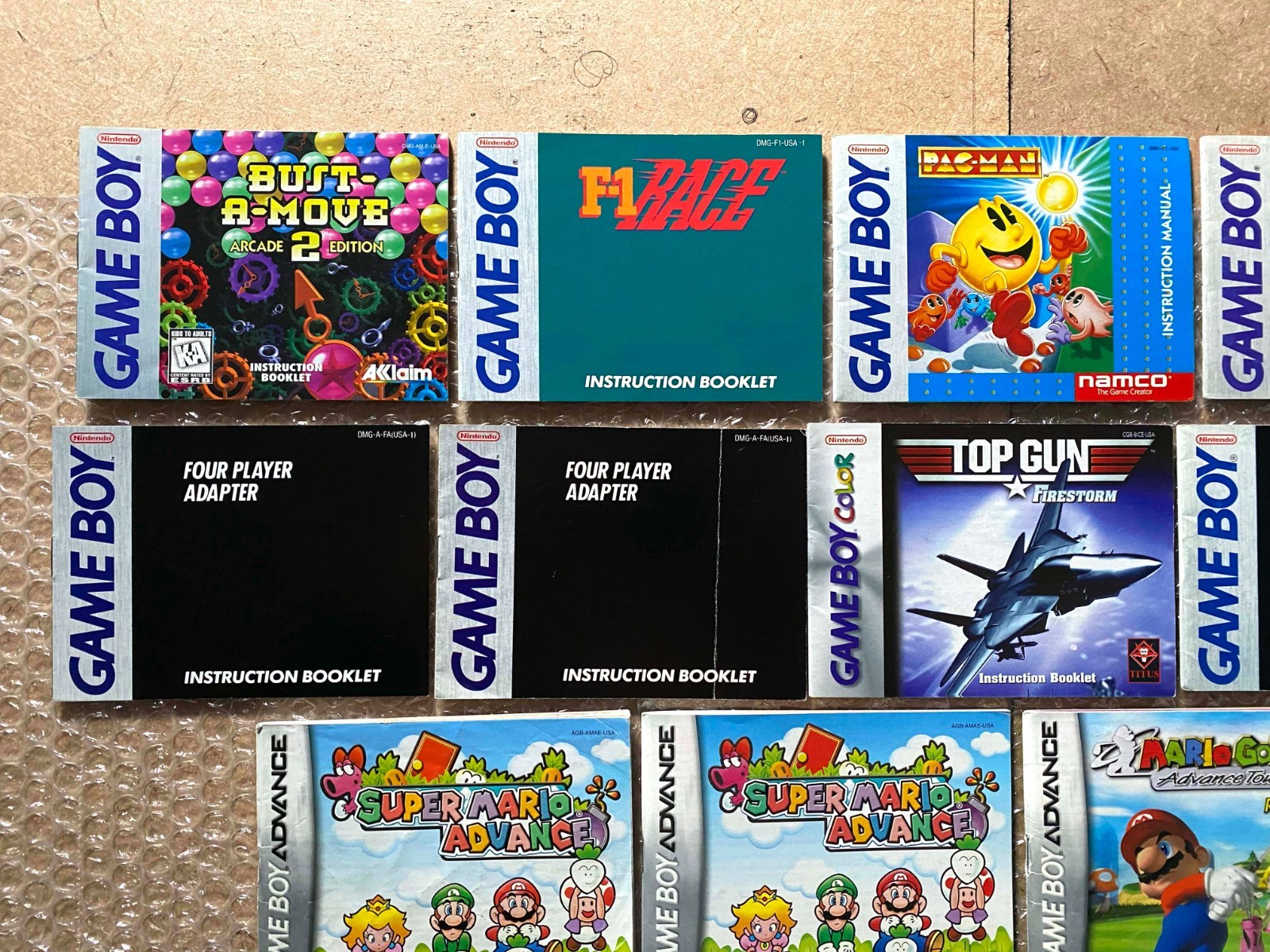 LOT OF 13 Game Boy/GBC/GBA Manuals (Mario Yoshi Pac-Man Bust-A-Move Top Gun)