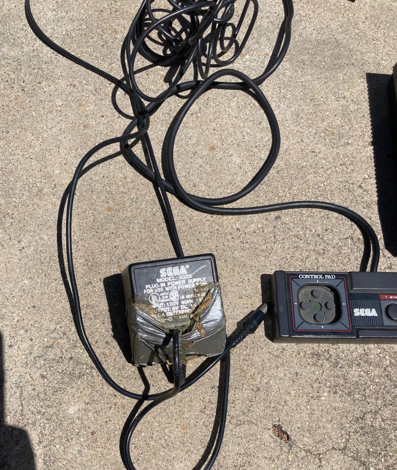 2 sega master system consoles with 3 controllers and games (not sure if it works