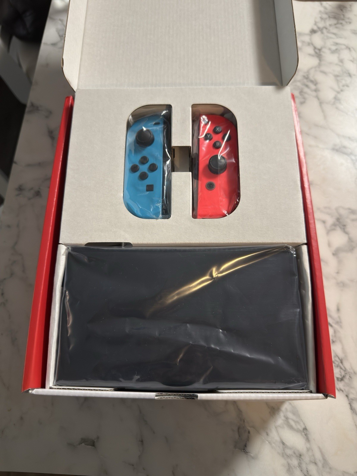 Nintendo Switch OLED (Barely used Console Neon red/blue Joy-Con, original pack)