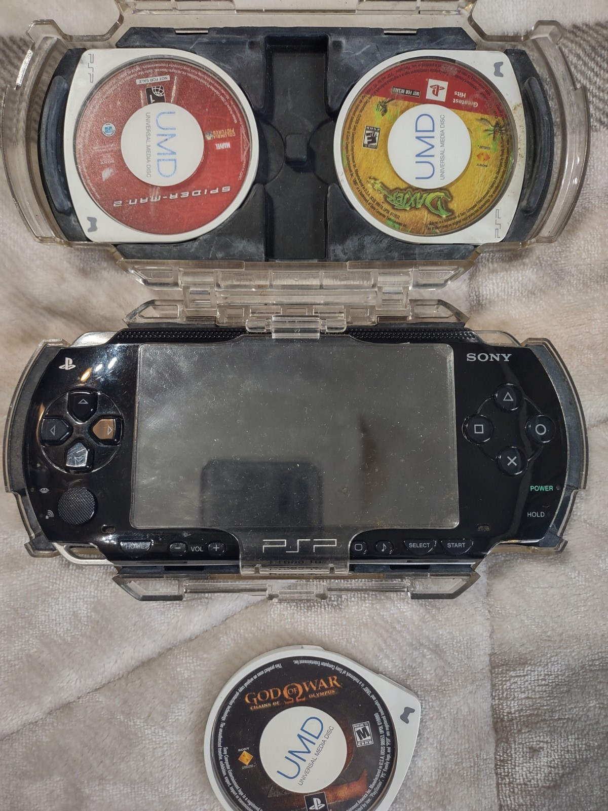 Sony PlayStation PSP-1001 w/Clear Travel Case, Charger, Memory, 8 games 1 movie
