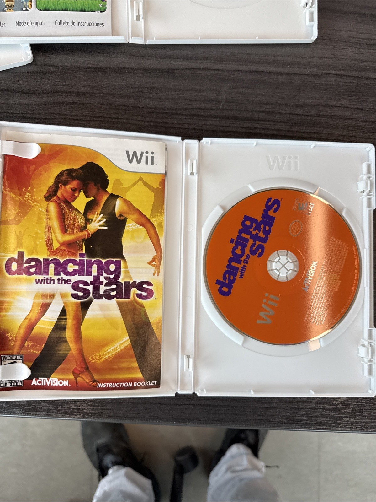 3 Popular Wii games In their Cases With Pamphlets.