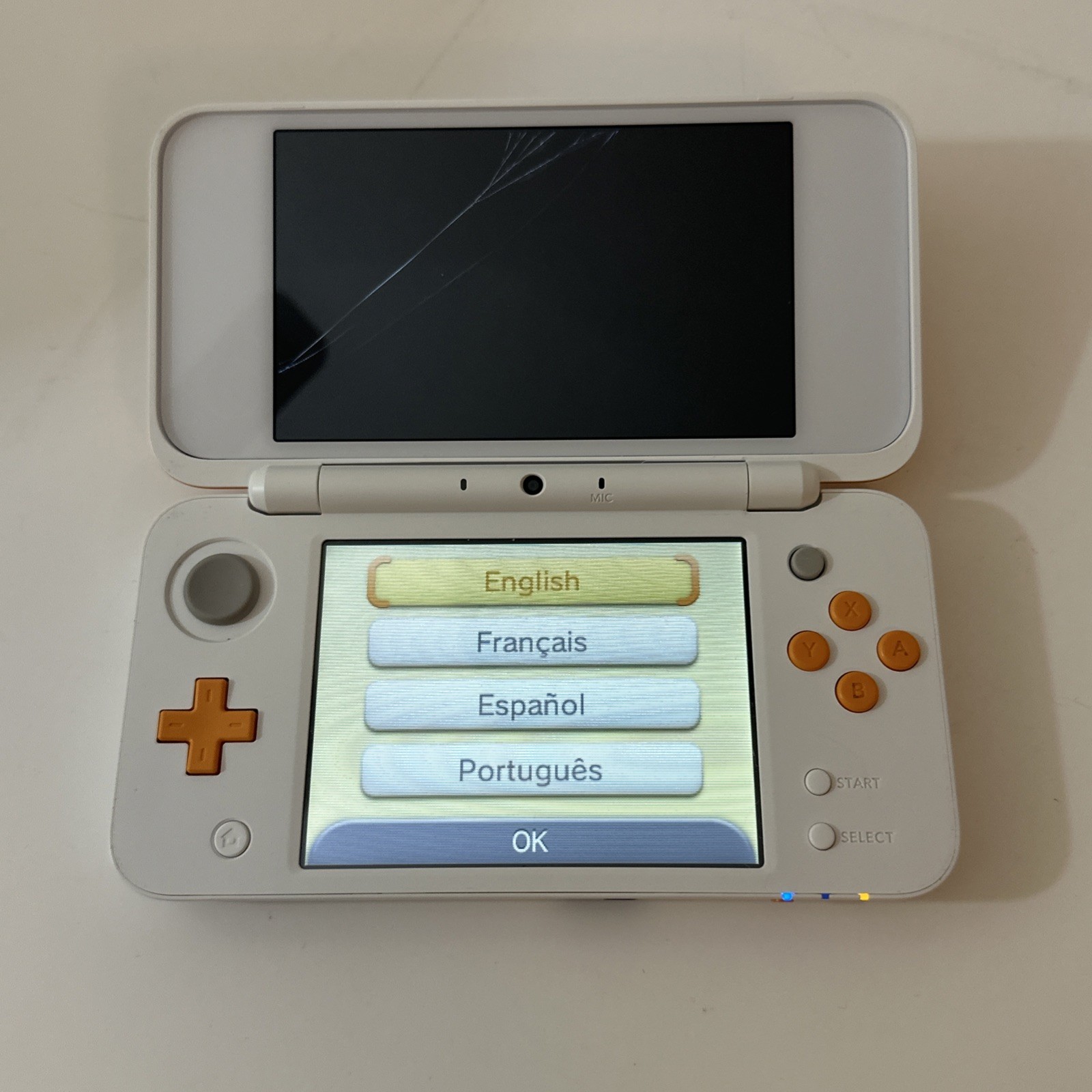 Nintendo 2DS XL – Orange & White Bundle (Top Screen Crack/ Non-OEM Charger)