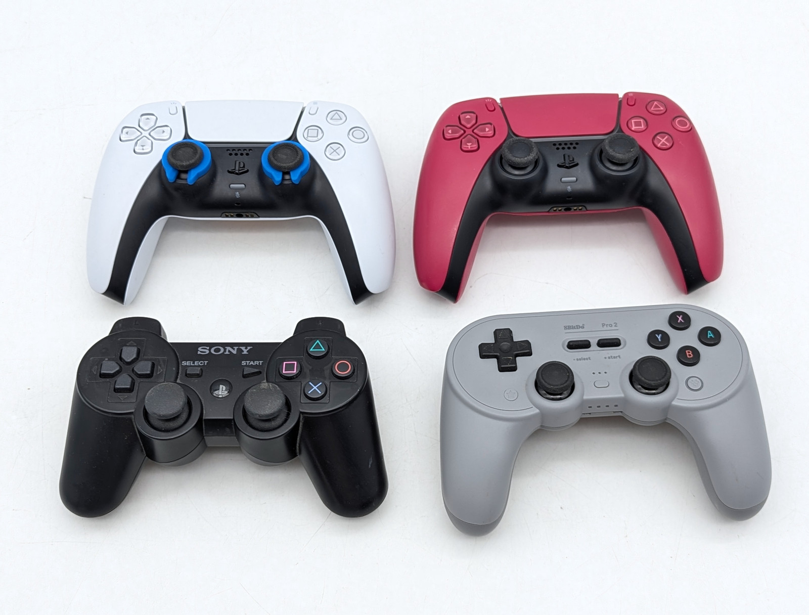Assorted Wireless PlayStation Video Game Controllers & Charging Station Lot of 9