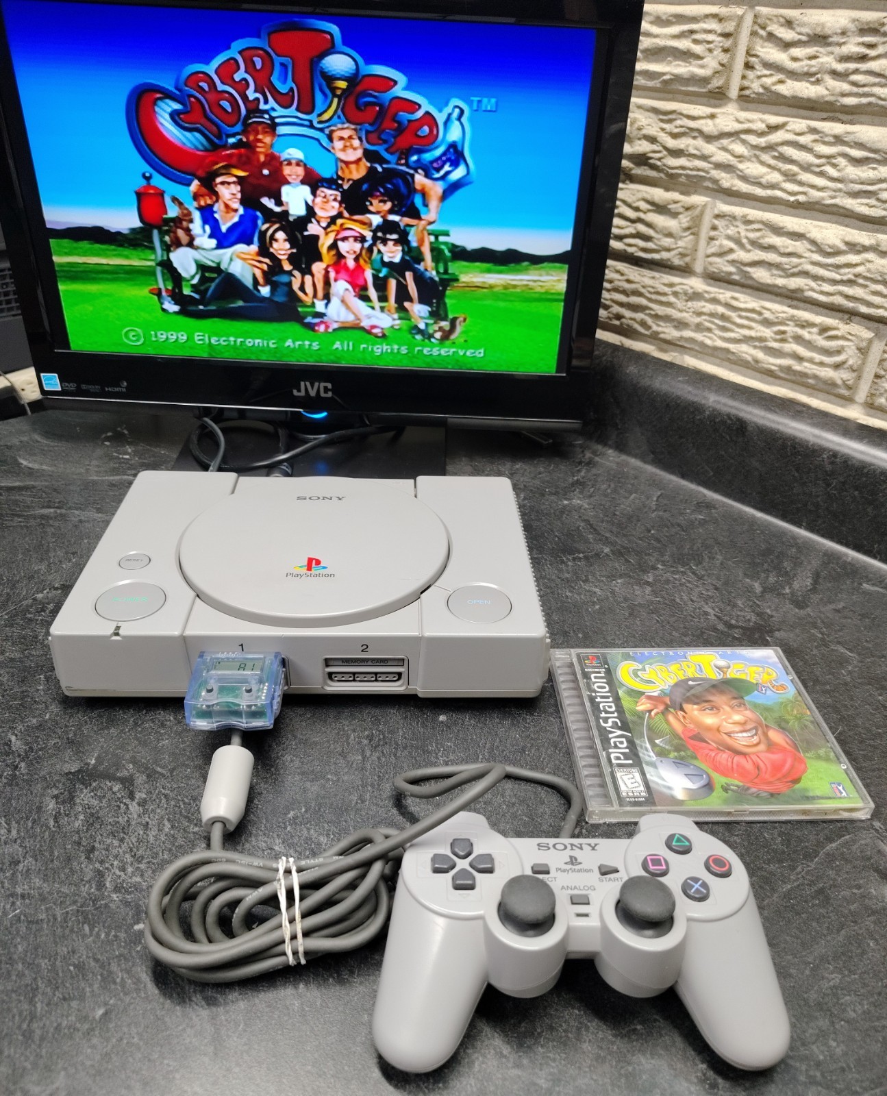 Sony PlayStation 1 SCPH-7501 W/ 2 Games 1 Controller Cables Mega Mem Card Tested