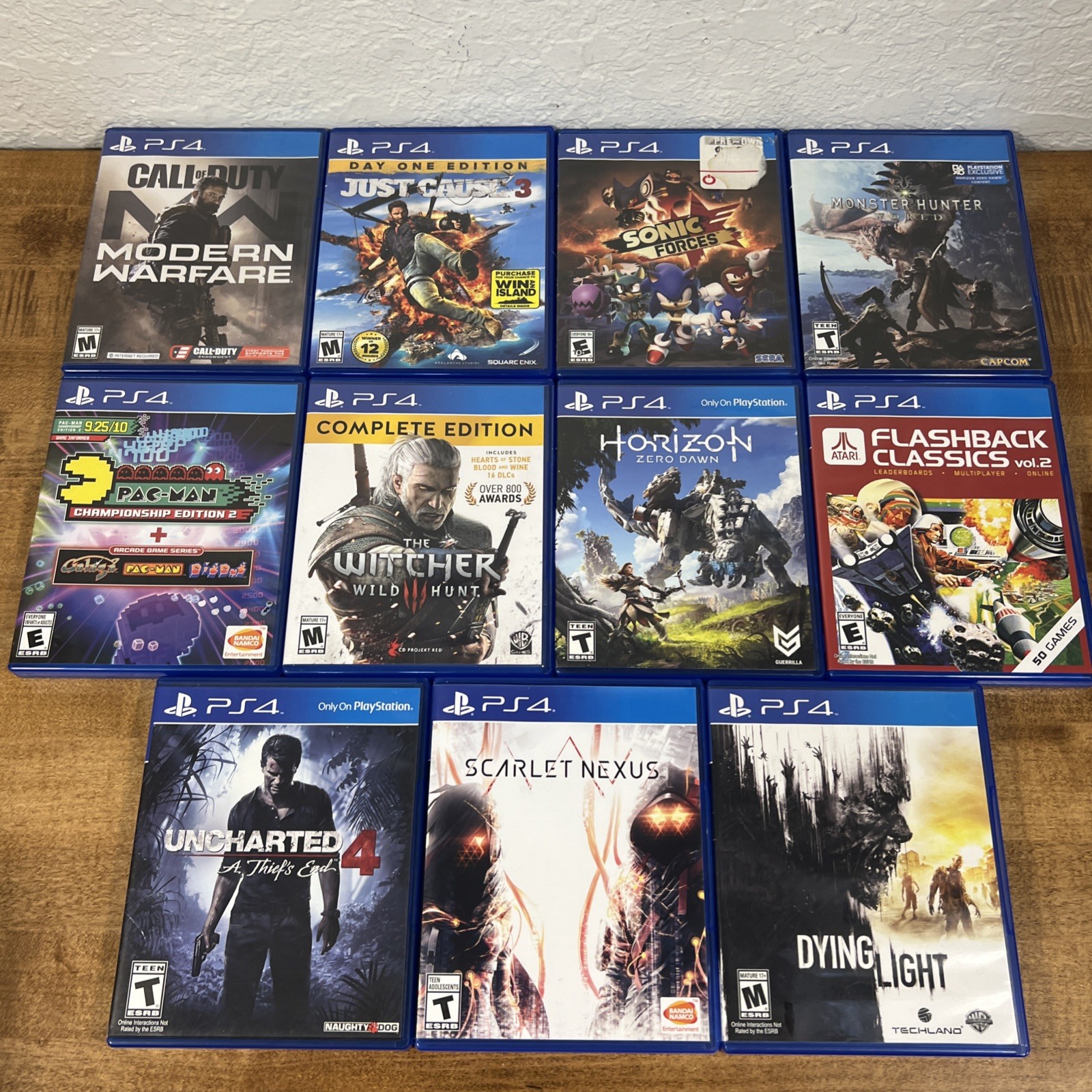 Lot of 11 PS4 Uncharted 4, Dying Light, Horizon, Monster Hunter, Scarlet Nexus..