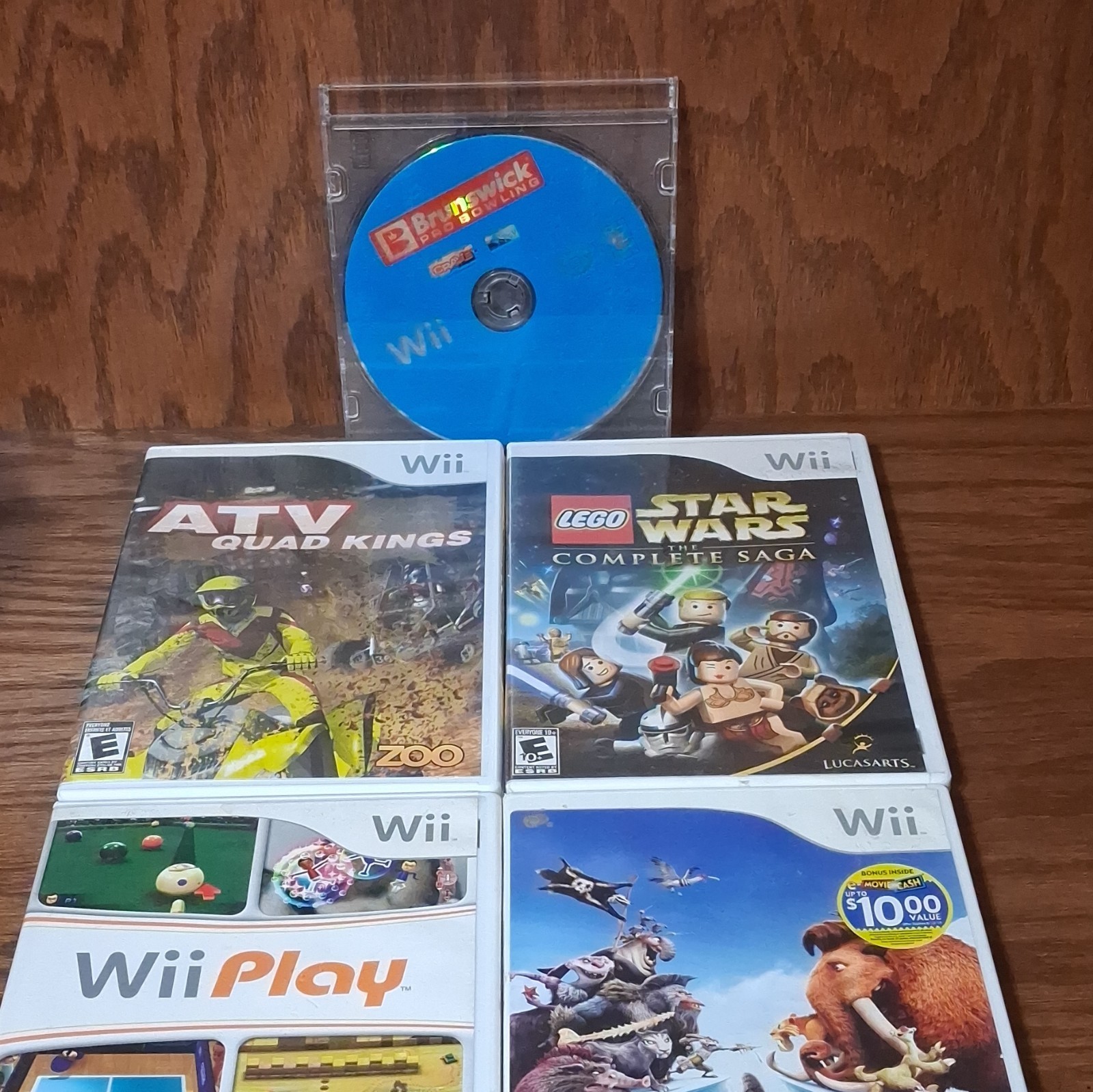 Nintendo Wii Game Lot: Ice Age, Wii Play, LEGO Star Wars, ATV Quad Kings & more.