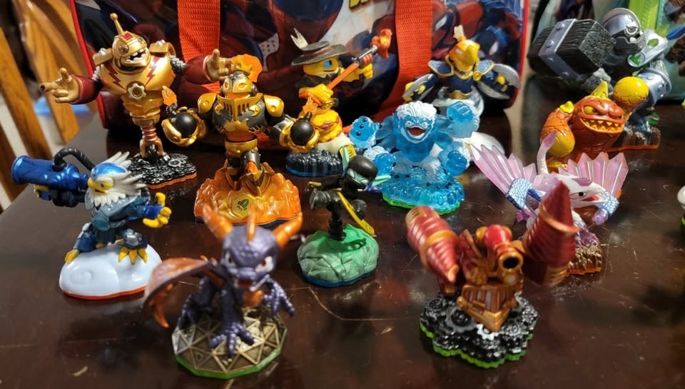 Skylanders collection of figures, 3DS games, items, vehicles, and carrying bags