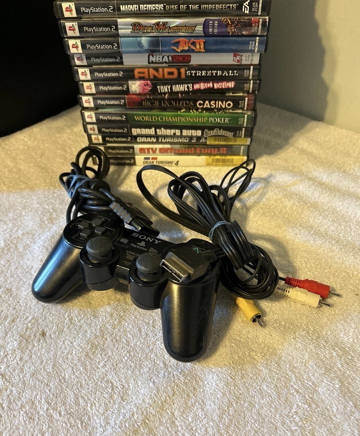 PlayStation 1, 2, & 3 Game lot. 19 total games & PS2 wired controller. Used