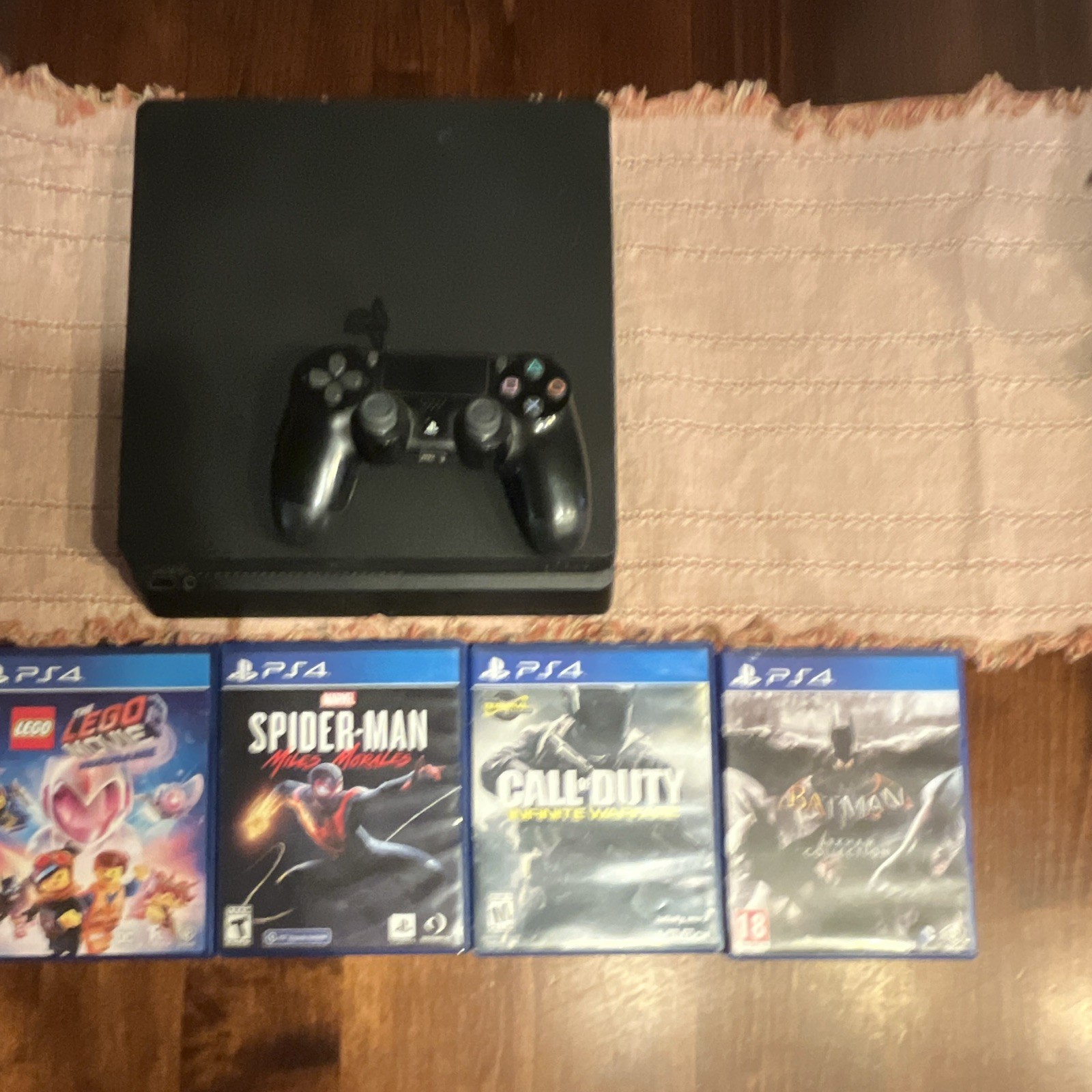 Sony PlayStation 4 Slim Console + DualShock 4 Controller, 4 Games and cables