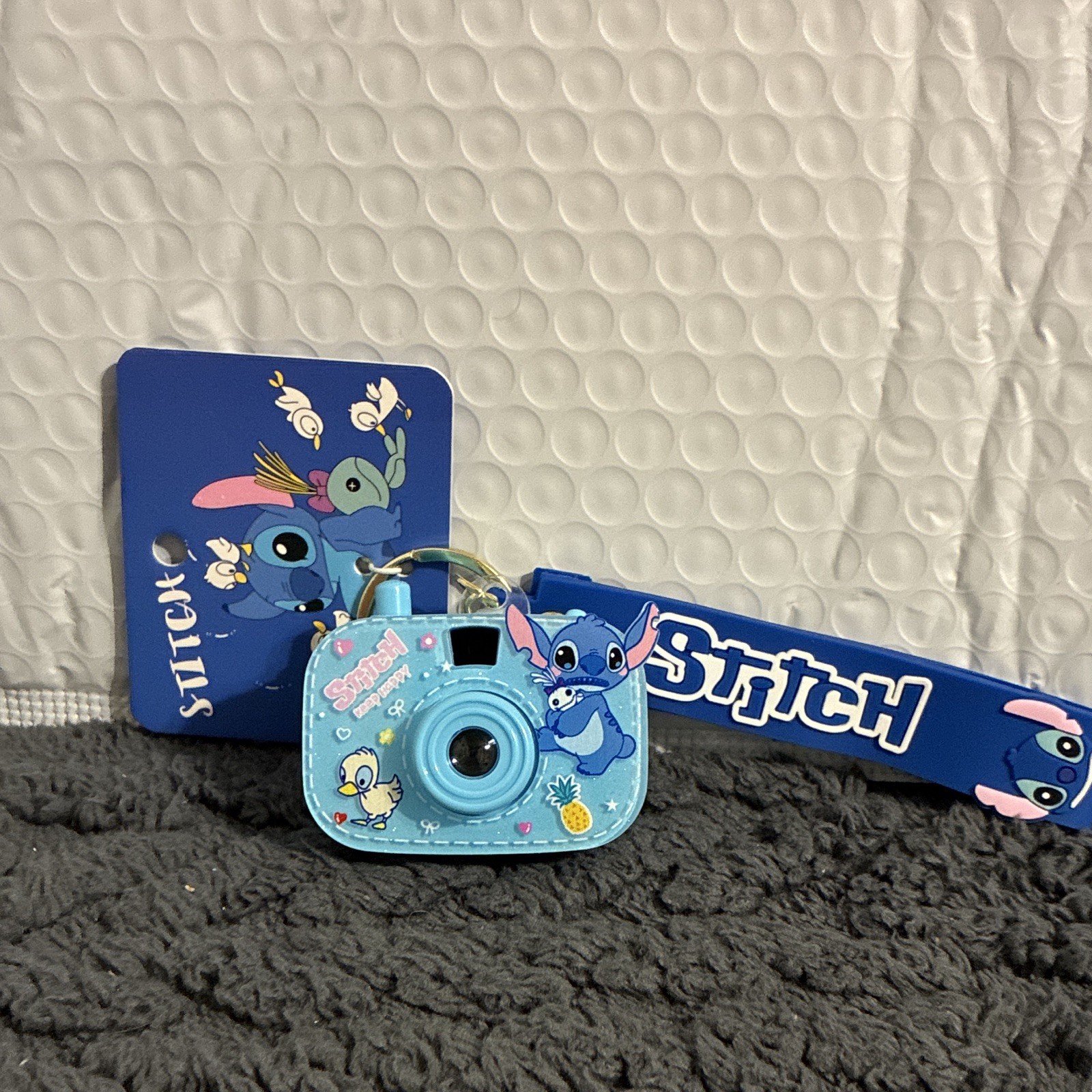 Disney Stitch Keychain – new one in bag/each click shows a new image on wall