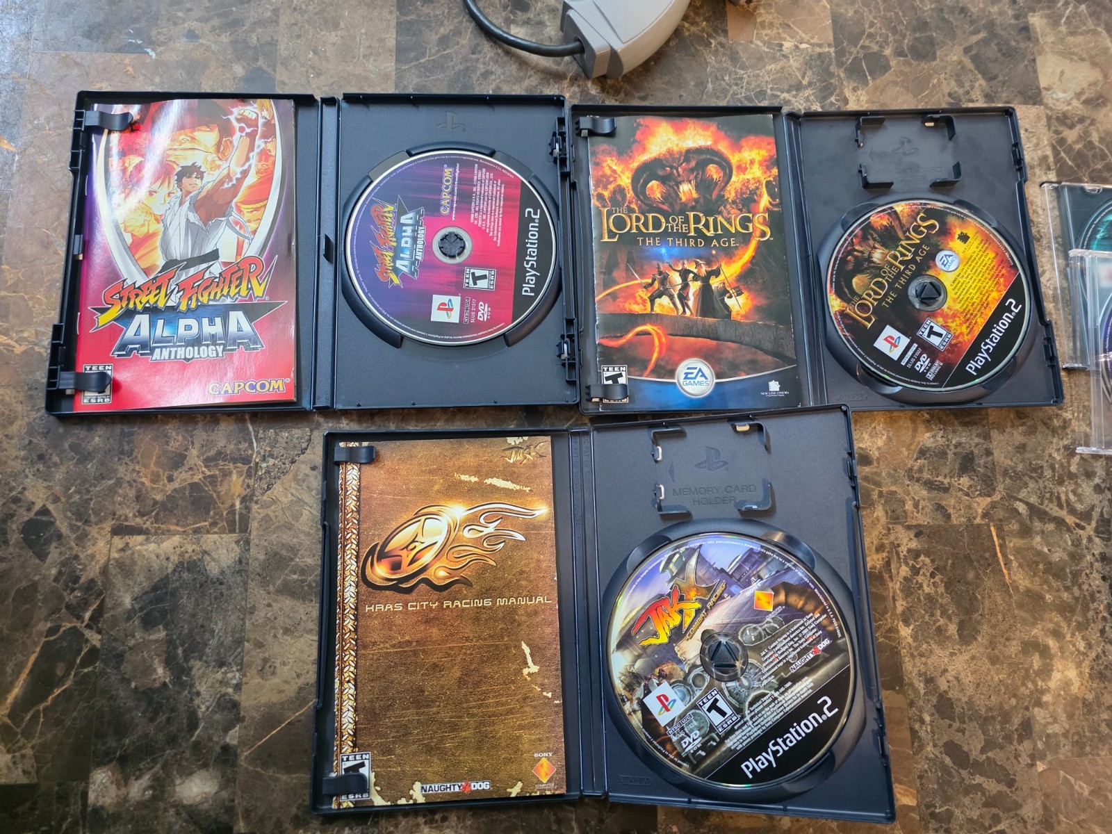 PS2 Slim Console + 13 games+Guncon+ SF Controller + Xmen vs Street Fighter etc.
