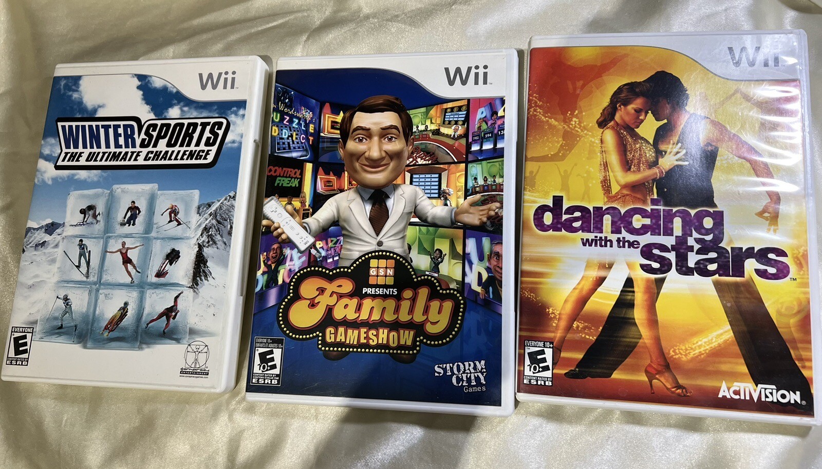 Lot of 3 NINTENDO Wii GAMES -Family Gameshow, Dancing w/Stars, Winter Sports- E