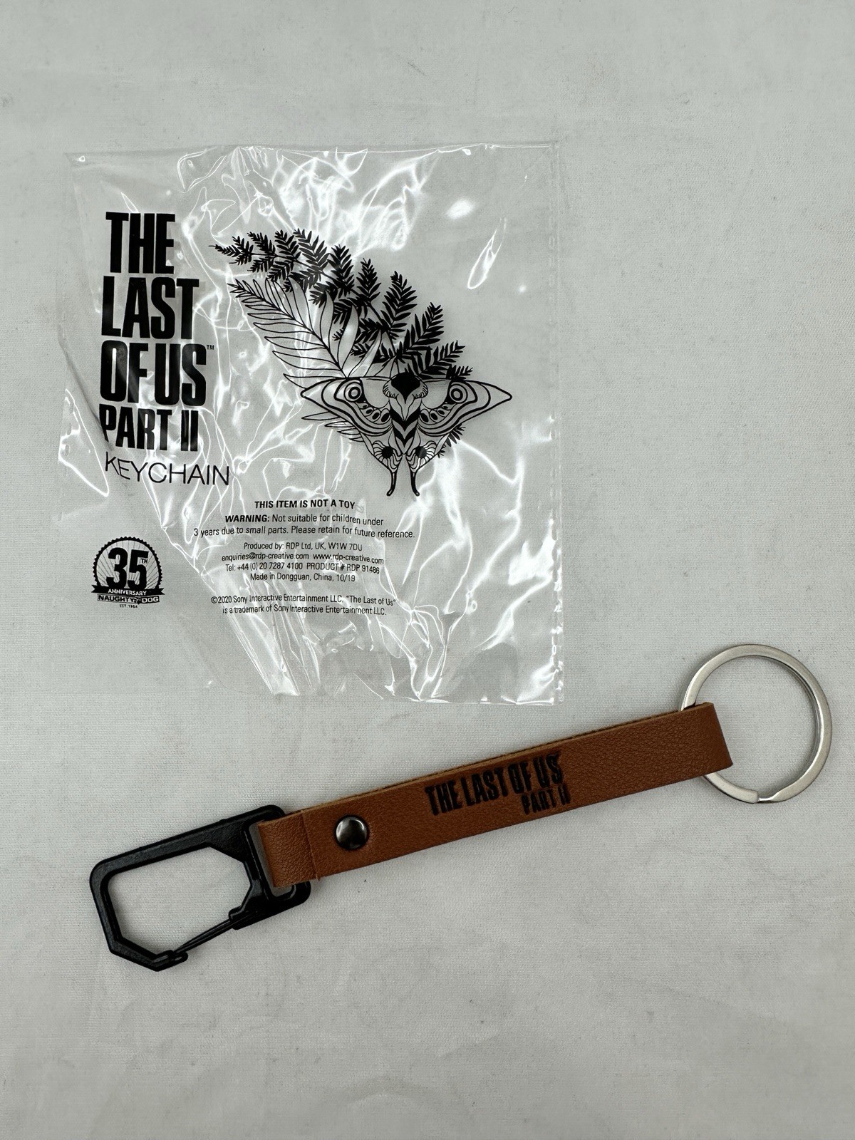 The Last of Us Part II – Promo Keychain RARE – 35th Anniversary Naughty Dog