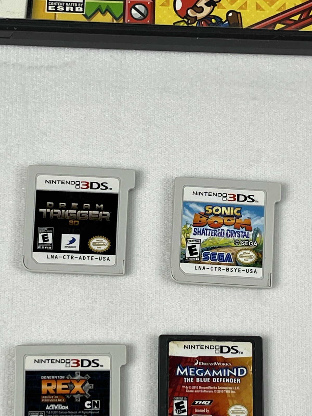 Nintendo 3DS XL Red Bundle w/ Charger, Stylus, SD Card, and 15 DS/3DS Games