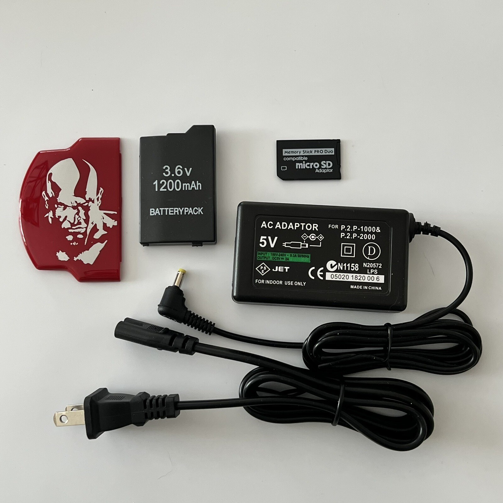 QUALITY PSP 2000 Kit – Battery, Charger, God Of War Cover, 64gb Memory Card