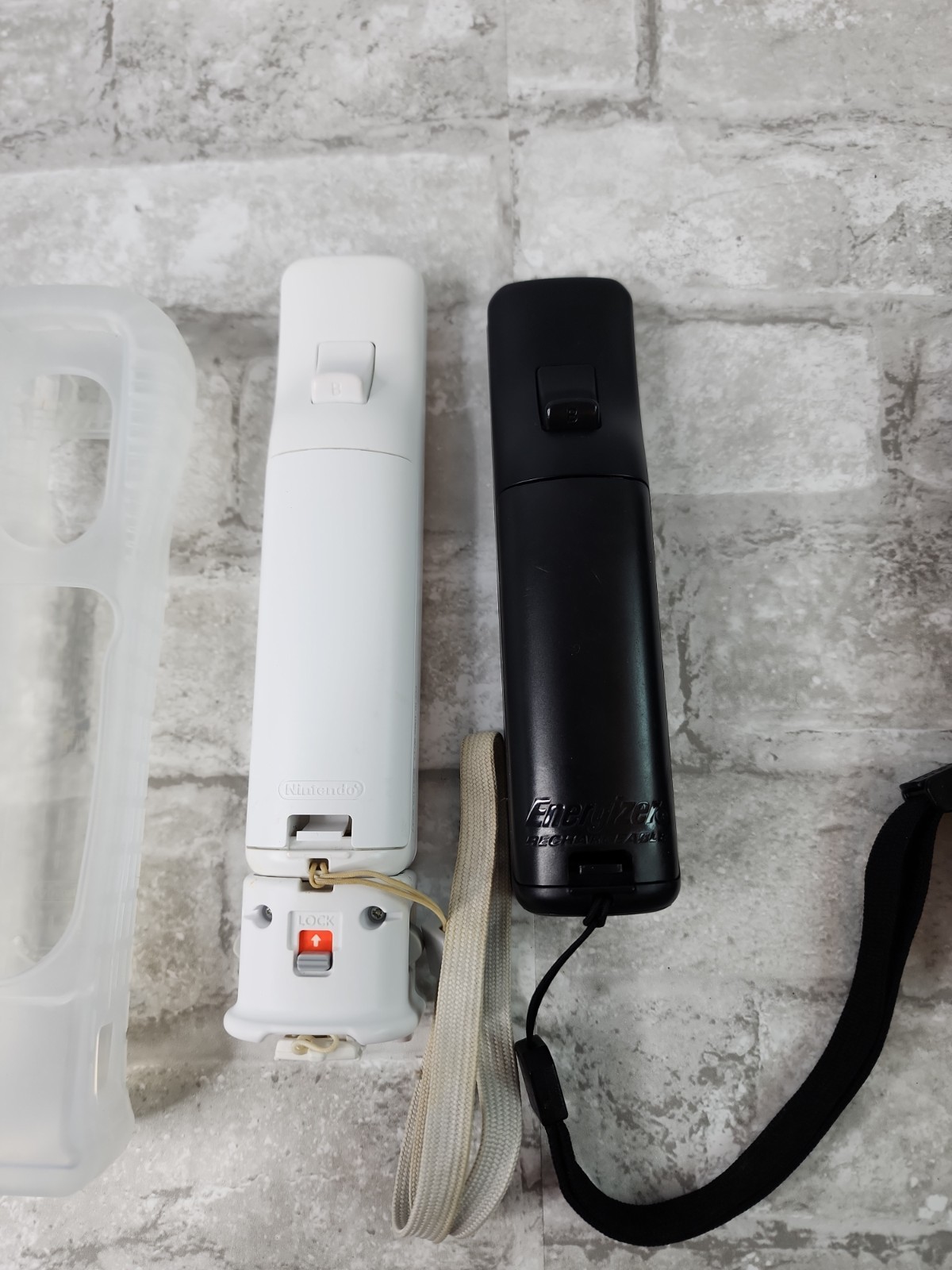 Lot Of 2 Nintendo Wii OEM Wiimotes Remotes Motion Plus Black & White w/ Covers
