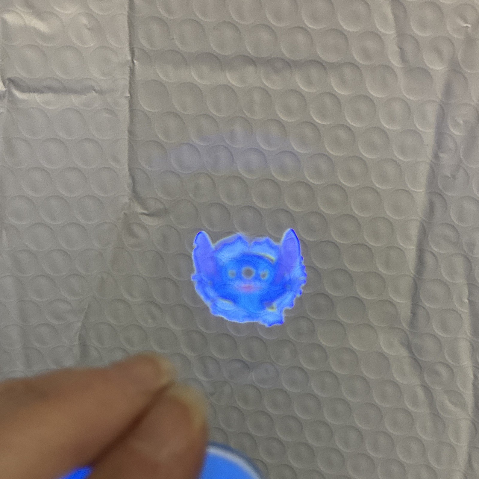 Disney Stitch Keychain – new one in bag/each click shows a new image on wall