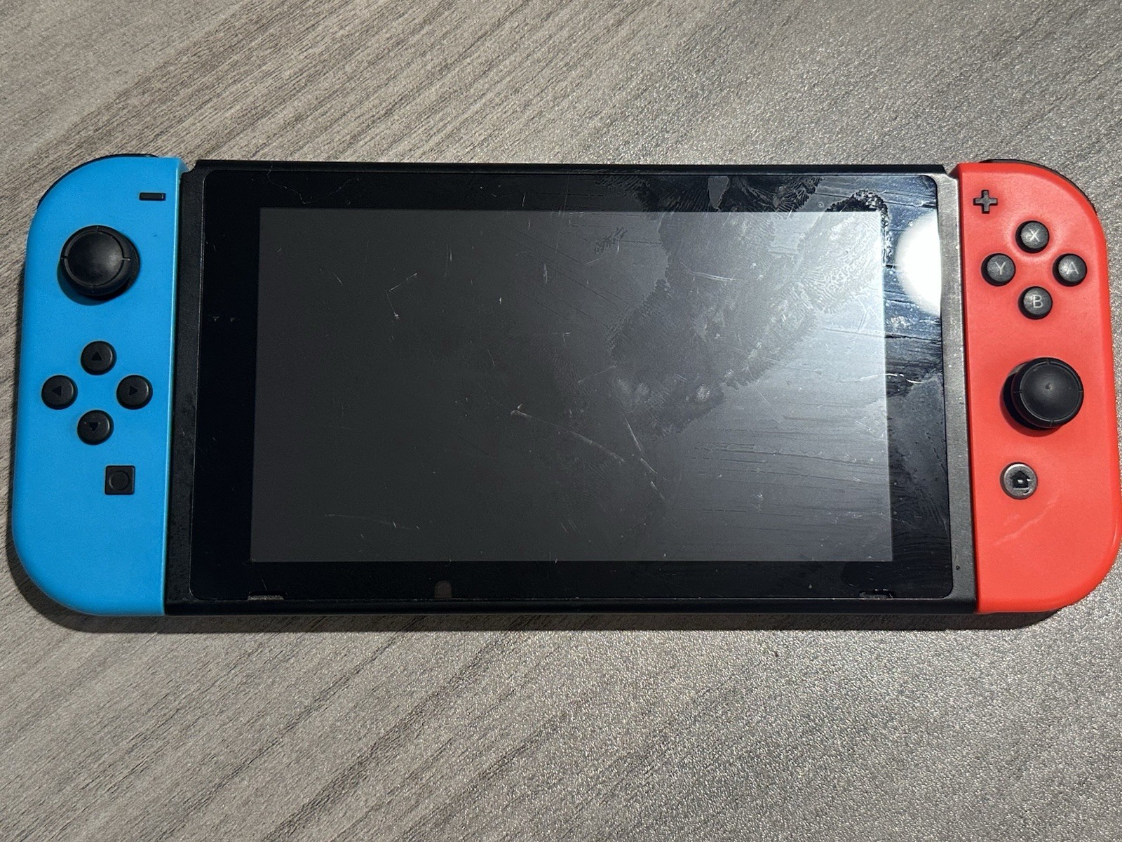 Nintendo Switch Handheld Video Game Console w/ Neon Blue & Red Joy-Con HAC-001