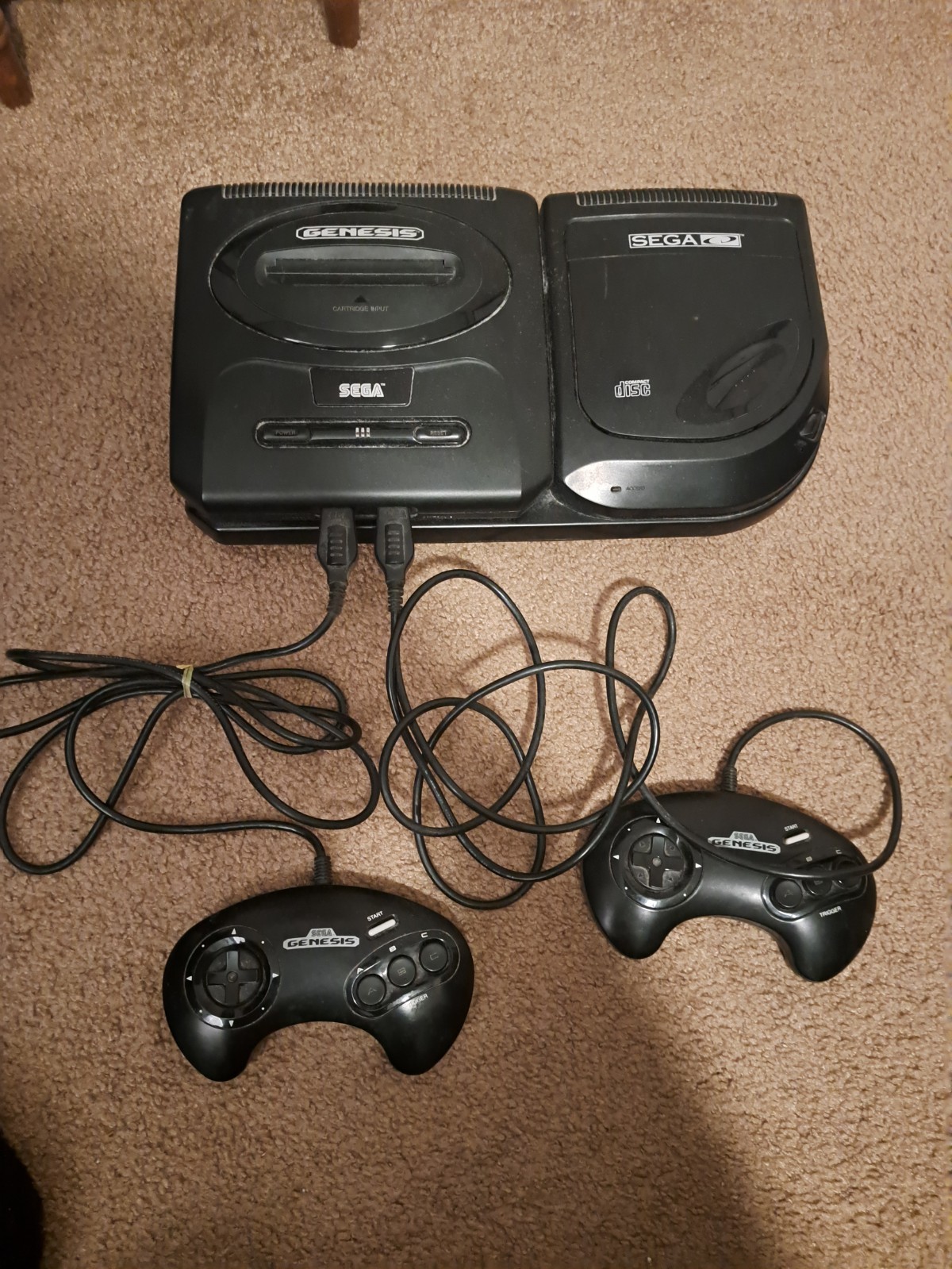 Sega Genesis CD Console. Comes with all of the cords, 2 controllers, and 3 games