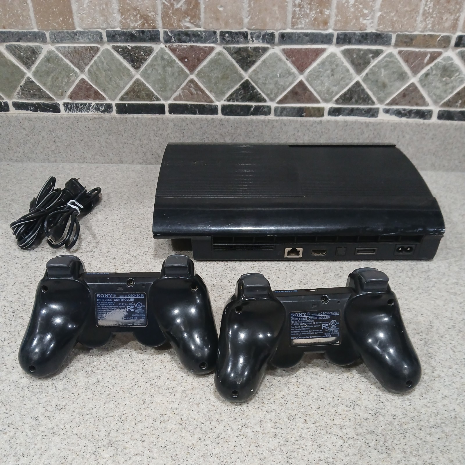 Sony PlayStation 3 PS3 Super Slim cech 4001B Black Console 2 Controllers
