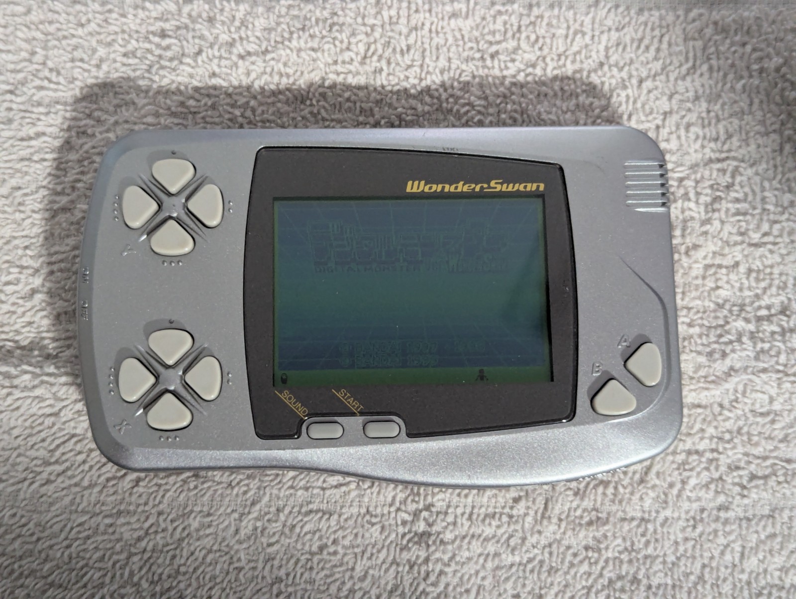 Bandai WonderSwan, Silver. With Digimon