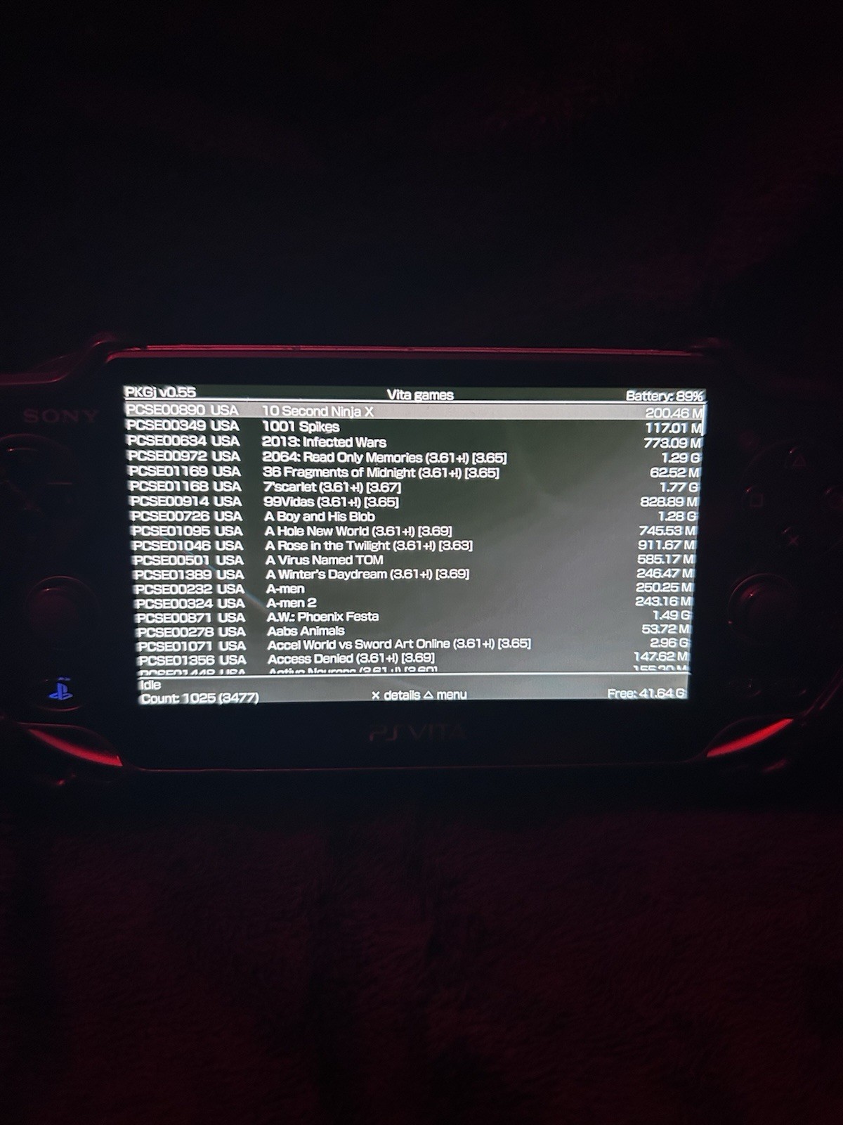 Sony PS Vita PCH-1000 Black 4GB Wi-Fi Handheld w/ Memory Card & Adapter