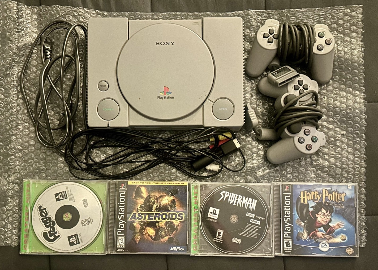 Sony PlayStation 1 Console (Gray), two Compatible Controllers, four PS1 Games