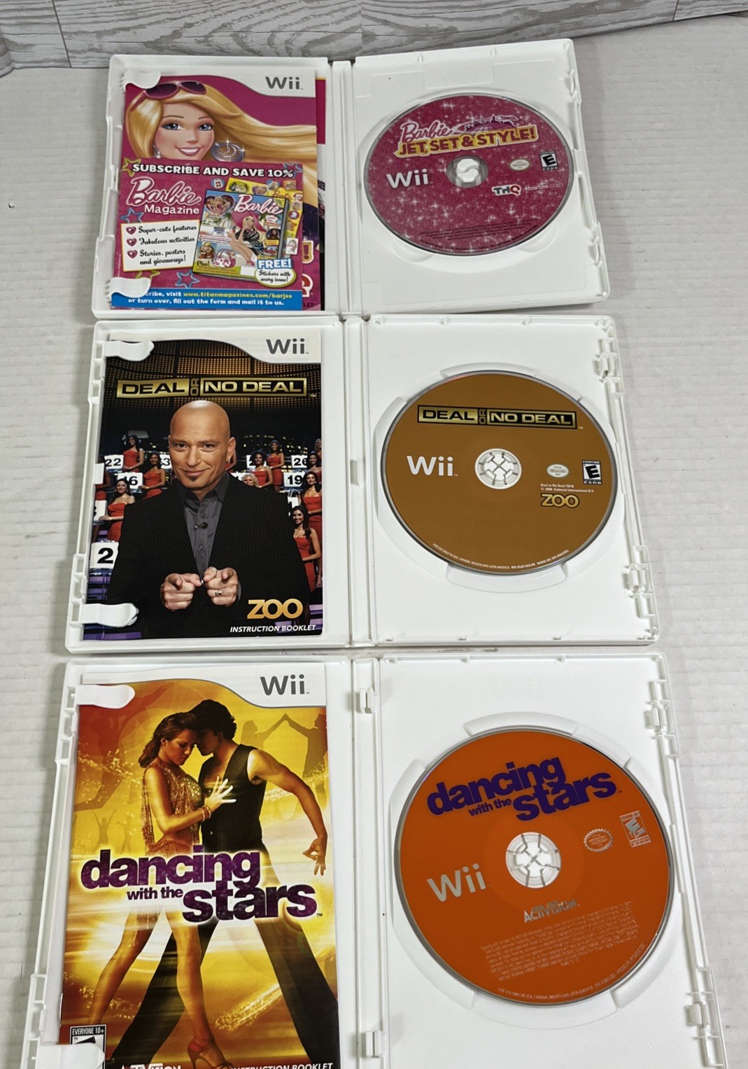 Lot of 8 Nintendo Wii Games Barbie Dora Wii Fit Plus Puzzle Deal or No Deal.