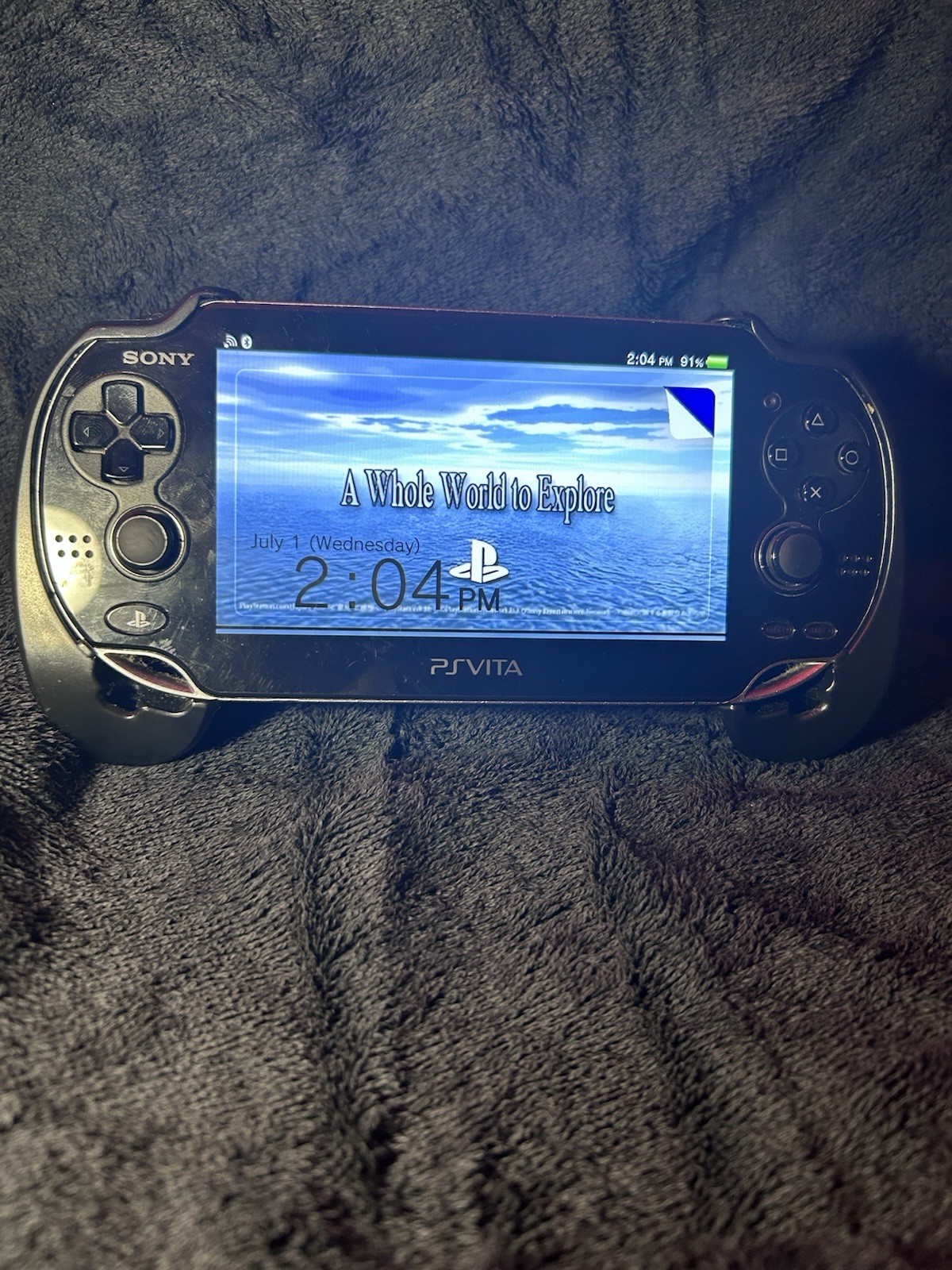 Sony PS Vita PCH-1000 Black 4GB Wi-Fi Handheld w/ Memory Card & Adapter